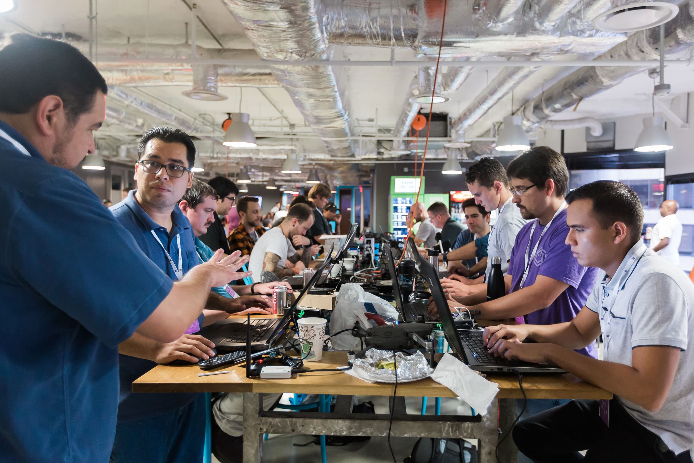 A full row of hackers building side by side